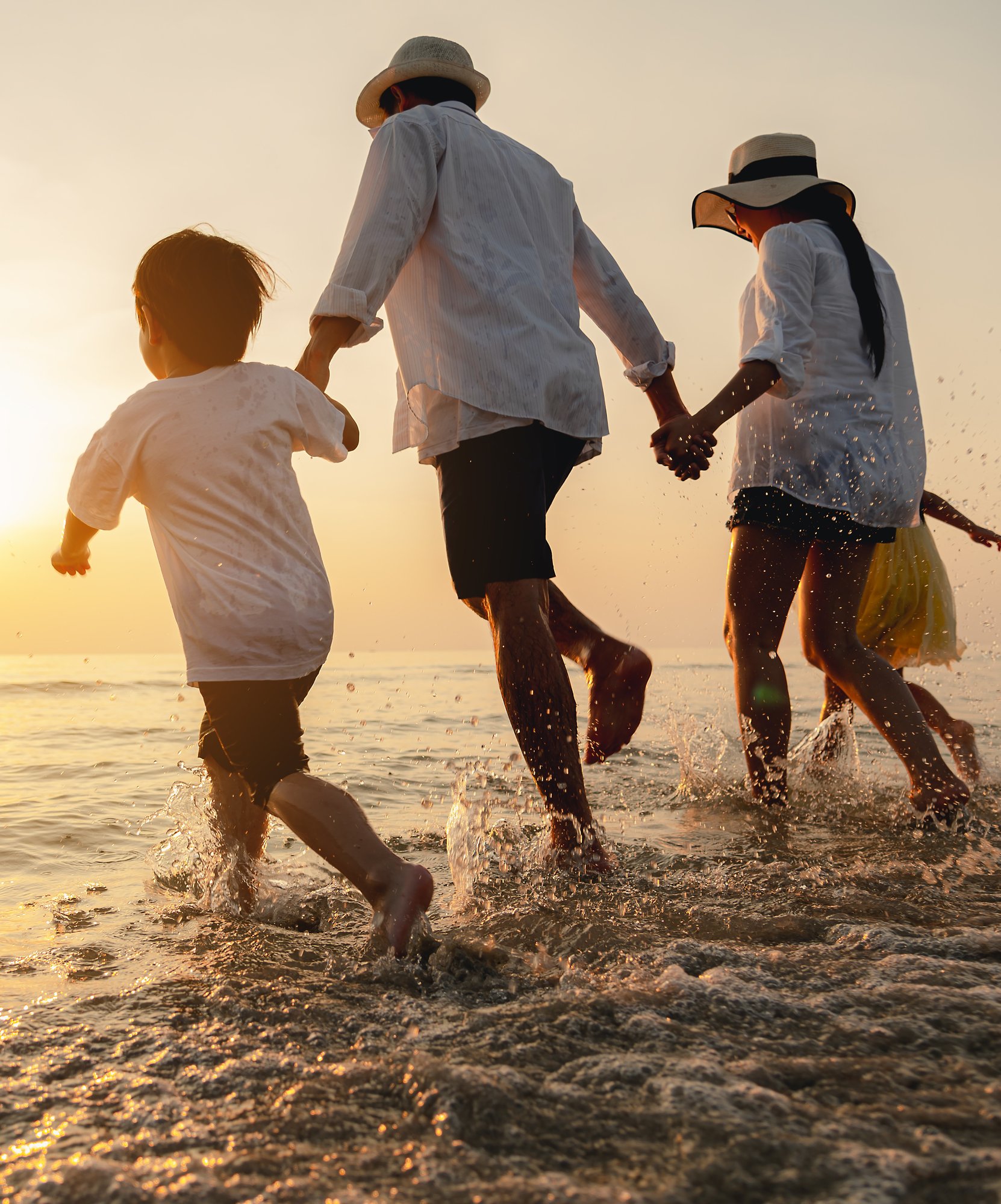 family playing in water
