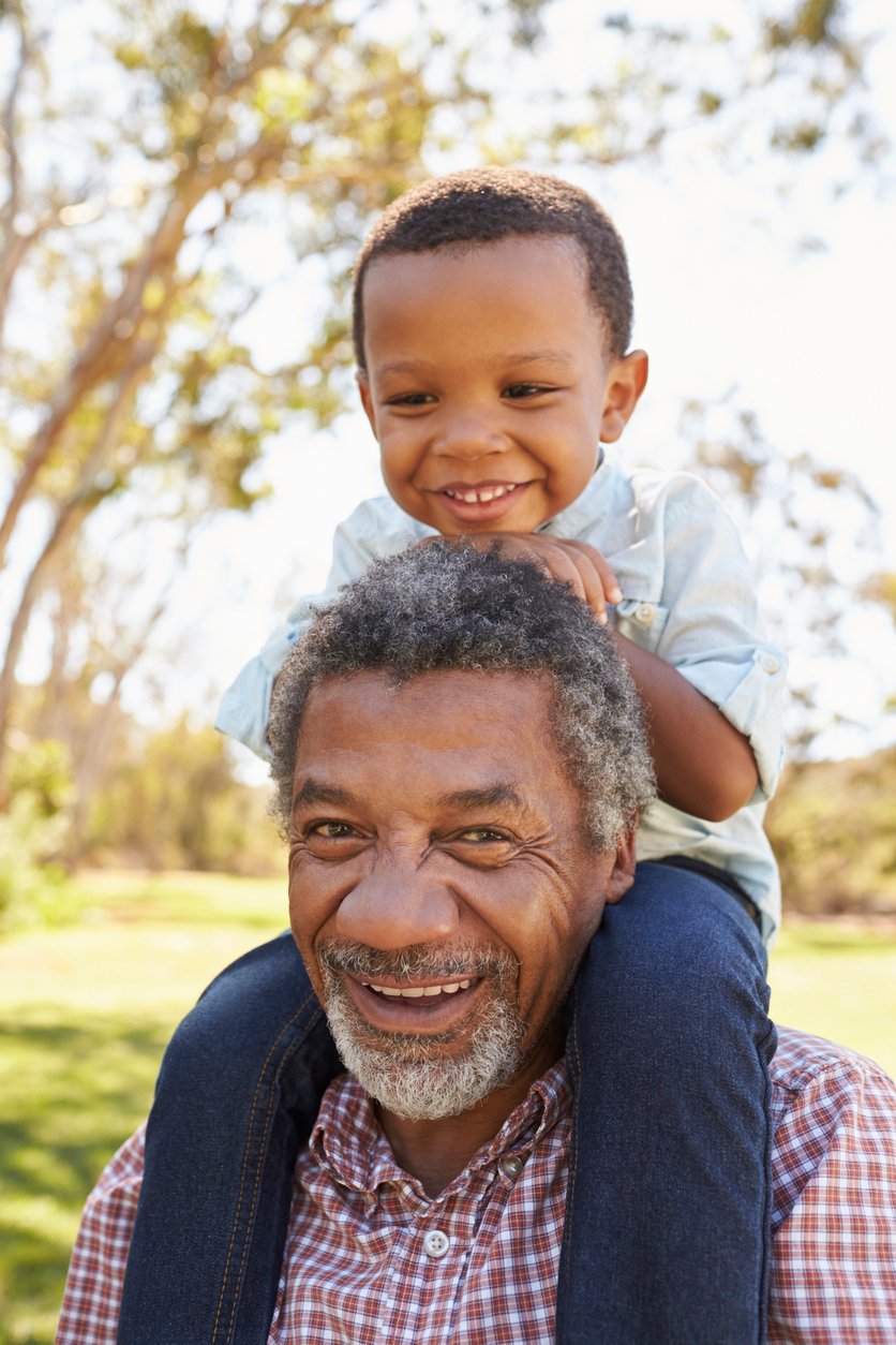 grandfather-carrying-grandson-on-shoulders