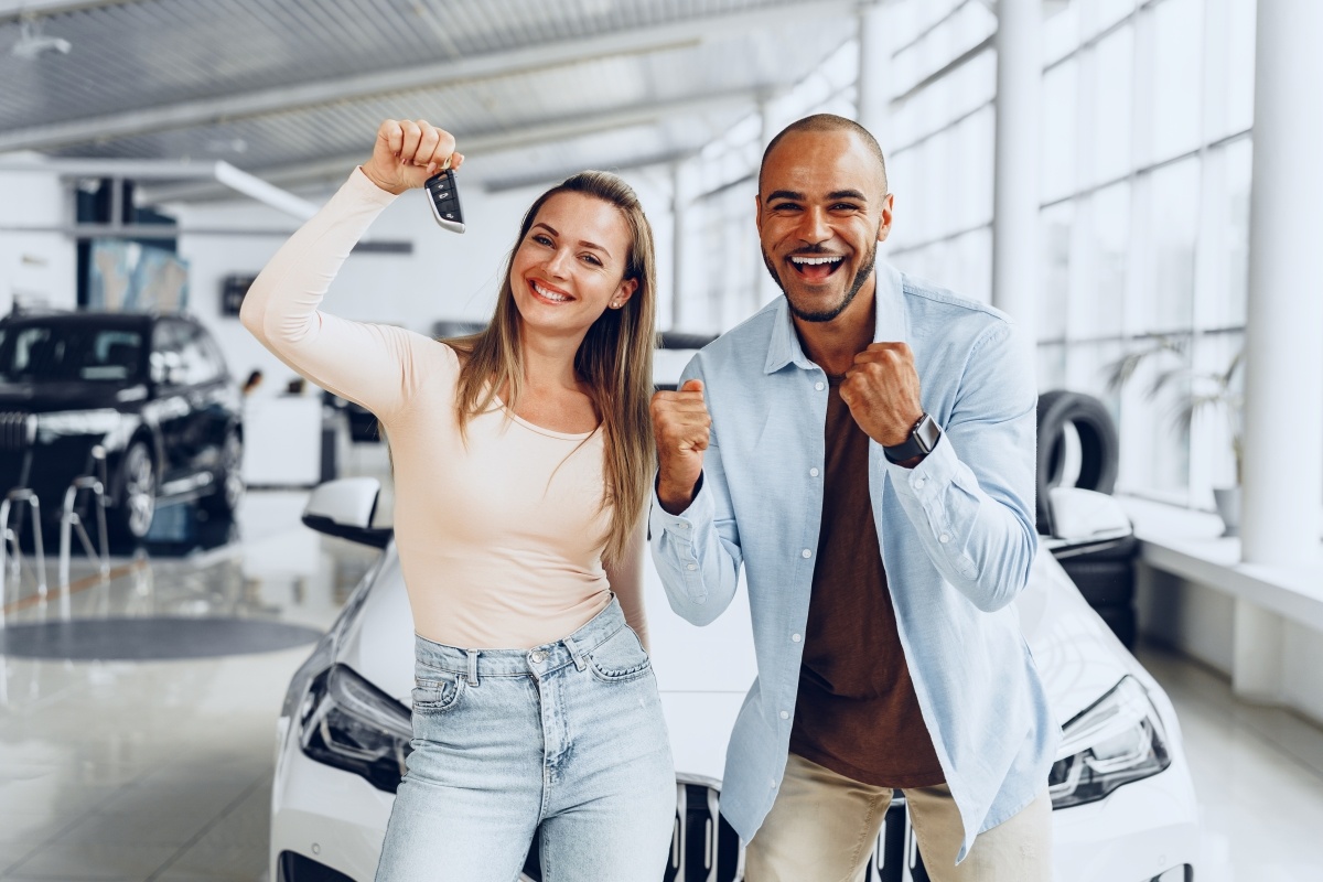 happy-excited-couple-buying-a-new-car-and-showing-2023-11-27-05-05-20-utc